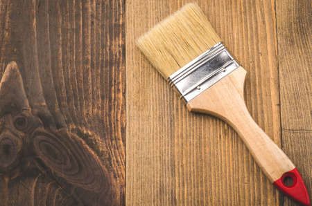 brush on a wooden background top view / paint brush lying on a wooden backgroundの写真素材