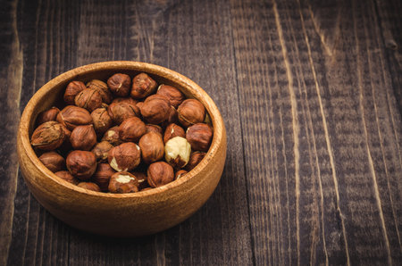 wooden bowl with nut a filbert, wooden bowl with nut a filbert with a blank space for the text
