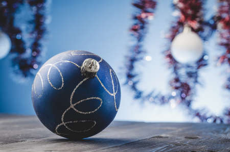 bllue Christmas ball on a blue light background. Selective focusの写真素材