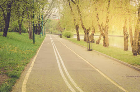 bicycle track in the park along the river/bicycle track in the park along the river in sunny dayの写真素材
