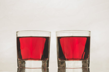 glasses with red drink/glasses with red drink on a white background.