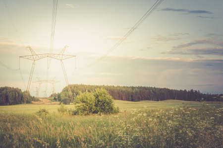 electro high voltage towers/electro high voltage towers against the on a background sunset. Tonedの写真素材