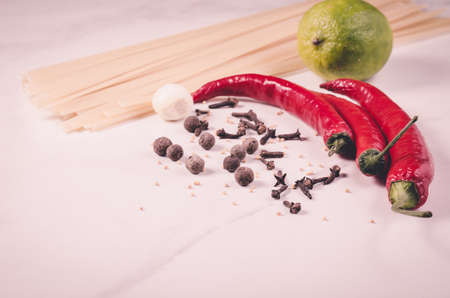Ingredients for cooking spaghetti/Ingredients for cooking spaghetti on a white marble background. Toned

の写真素材