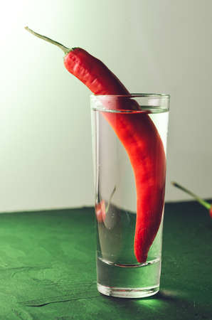 Drink set with shot of vodka and red pepper/Drink set with shot of vodka and red pepper. Selective focusの写真素材