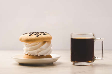 Coffe glass with dessert/Coffe glass with dessert on white marble background.の写真素材