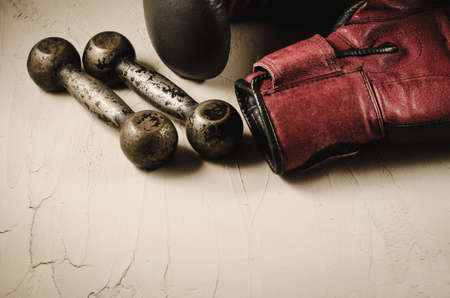 boxing gloves and dumbbells/boxing gloves and dumbbells on a stone backgroundの写真素材