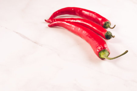 red Chilli on white marble background. Copy spaceの写真素材