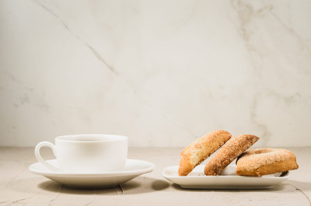 coffee cup and homemade cookies/coffee cup and homemade cookies on a white table, selective focus