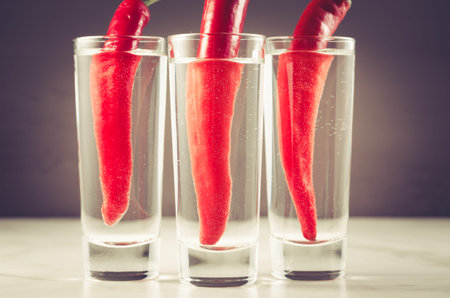 Drink set with three shots of vodka and red pepper/Drink set with three shots of vodka and red...