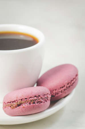 sweet macaroons or macaron and coffee cup on a white background, french dessertの写真素材