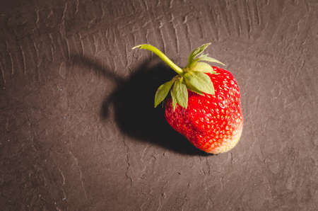 Fresh berry of strawberry on black table/Strawberry. Fresh berry of strawberry on black table closeupの写真素材