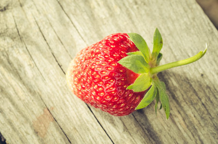fresh berry of strawberry on wooden table/fresh berry of strawberry on wooden table closeup. Top viewの写真素材