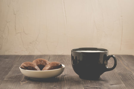 breakfast with chocolate gingerbreads and milk/breakfast with chocolate gingerbreads and milk in a...