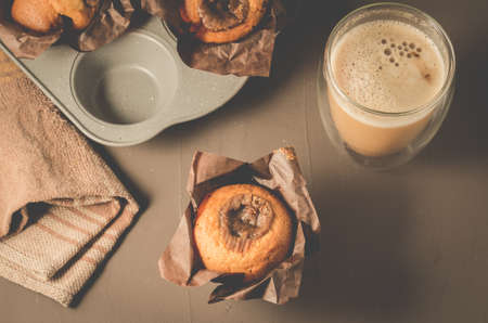 cakes with a chocolate stuffing and cappuccino glass/homemade pastries: cakes with a chocolate stuffing and cappuccino glass. Top viewの写真素材