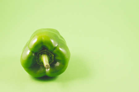 Green paprika close-up/Green paprika pepper over green background, copy spaceの写真素材