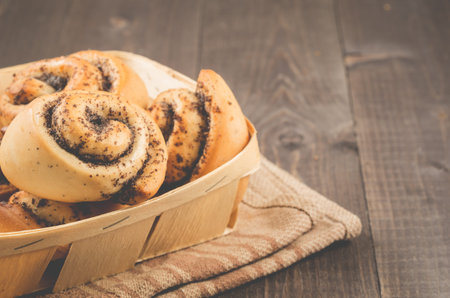 Fresh rolls with poppy a wooden boxの写真素材
