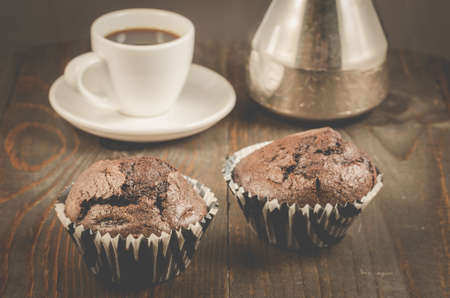 Two chocolate muffins, coffee cup and turksの写真素材
