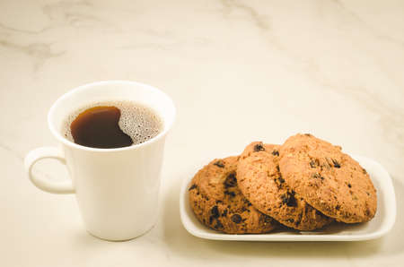 coffee cup and homemade cookies with chocolate/Breakfast whith coffee cup and homemade cookies with chocolate, selective focusの写真素材