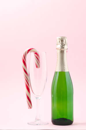 Bottle with sparkling wine and red caramel in glassware.の写真素材
