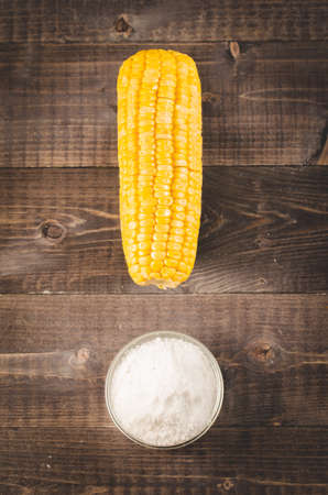 boiled corn with salt on a wooden background. Close up. Table top view. Healthyの写真素材
