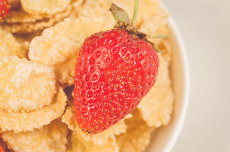 corn flakes with fresh strawberry/corn flakes with fresh strawberry closeup. Top view