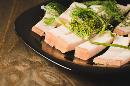 national Ukrainian dish fat with fennel on a wooden table, selective focus