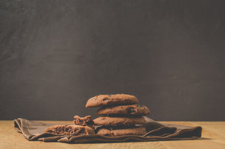Chocolate cookies on wooden table. Chocolate chip cookies shot/Chocolate cookies on wooden table on...