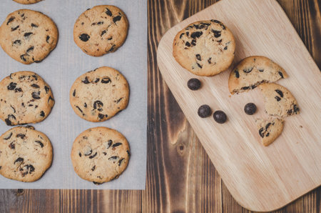 Cookies with chocolate filling on a wooden table. Fresh pastries/Cookies with chocolate filling on a...