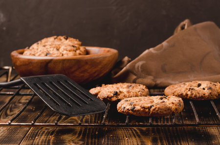 fresh homemade cookies in a wooden plate / cooked homemade cookies in a wooden plate. On a wooden...