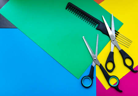 
Scissors and comb. Professional hairdresser scissors for cutting hair on a colored background. Barber equipment concept, premium hairdressing set. Haircuts Accessories with Copy Spaceの写真素材