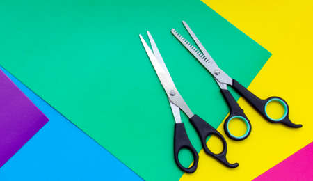 
Scissors and comb. Professional hairdresser scissors for cutting hair on a colored background. Barber equipment concept, premium hairdressing set. Haircuts Accessories with Copy Spaceの写真素材