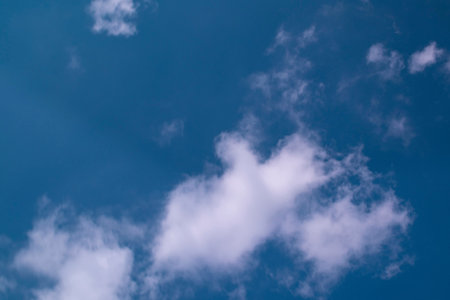 Large fluffy white clouds on the sky. Slow motion. Slowly moving clouds.