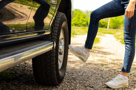 Broken wheel on a car and a girl. Selective focus.