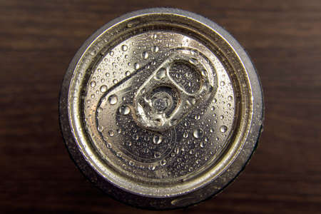 aluminum can of beer or water on a dark background, top view.drops of water on a cold jar. close-upの写真素材