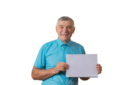 Elderly man posing on a white background. Holding a sheet of paper. People sincere emotions...