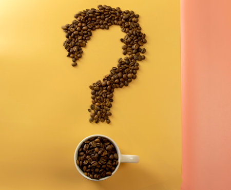 Concept with coffee roasted beans on a beige background. Top view with space for text. Flat lay ..の写真素材