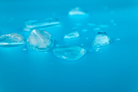 Blue background with ice pieces.
