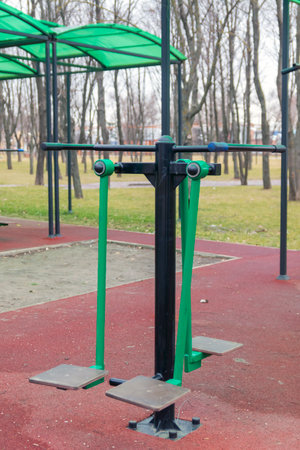 Sports equipment in a public park. Free outdoor gym. Outdoor sports equipment at park playgroundの写真素材
