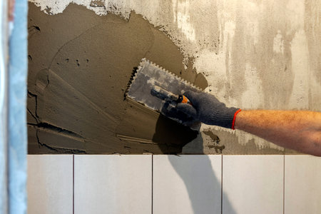 The process of laying tiles. Home improvement, home renovation conceptの写真素材
