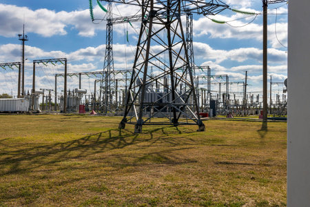 Panoramic view of high voltage switchgear with transformer, insulation and fittings.
