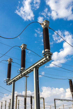 Gas-insulated current transformers at a high-voltage substation.