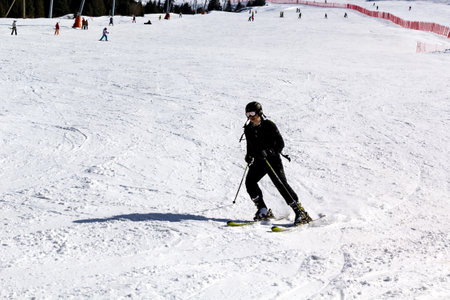 skier descends from the mountain on the ski runのeditorial素材