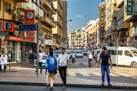 Dubai, UAE - January 9, 2017. Morning business day in old Dubai. Deyra- Dubai's old district, where the old port, the fish market, gold market, a variety of shops. The Dubai Creek Gulf tourists ride on the old Arab wooden boats - arbaのeditorial素材