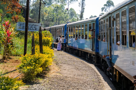 Rozelle, Sri Lanka - January 8, 2018. boarding a train at a small railway station