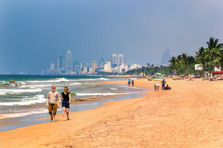 Colombo, Sri Lanka - January 11, 2018. people rest on the ocean shore on a sunny dayのeditorial素材