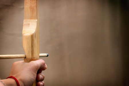 Hand of the arrow pulled the aunt with an arrow of the bow. Copy space. Tonedの写真素材