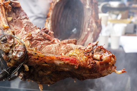 Pieces of lamb roasted on a spit over burning coals. Outdoor grillの写真素材