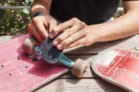 Repair and renovation of skateboarding elements in the home workshop. Tonedの写真素材