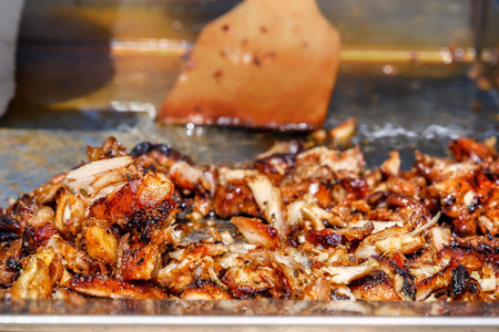 Fried meat for the preparation of donors or shawarma. Close-up. Copy space