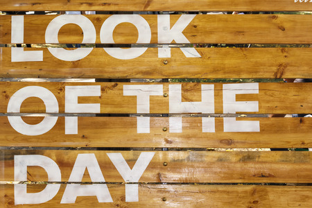 inscription on the boards with white paint Look of the day. background imageの写真素材